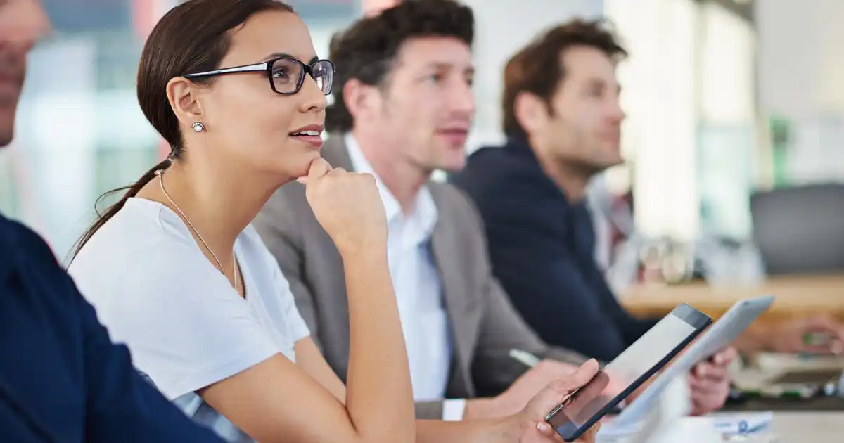 Employees listening at a training session